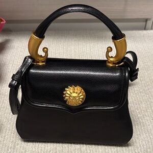 Vicenza Black Leather Top-Handle Bag with Gold Sun Medallion